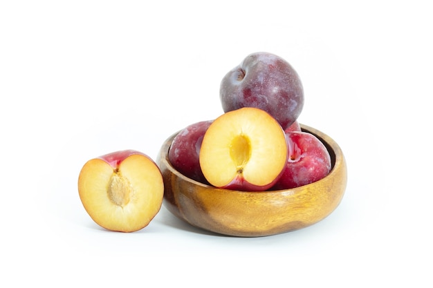 Fresh plum in wooden bowl on background, Healthy food.
Julee plum.
