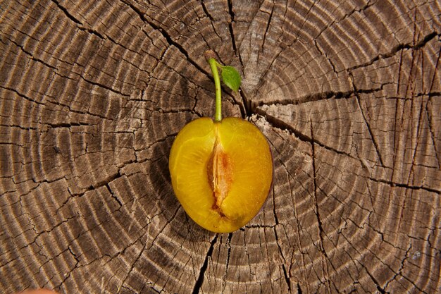 Fresh plum on wooden table