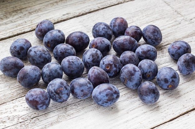 Fresh plums in cup