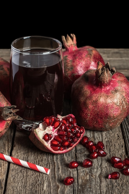 Fresh pomegranate juice on wooden table