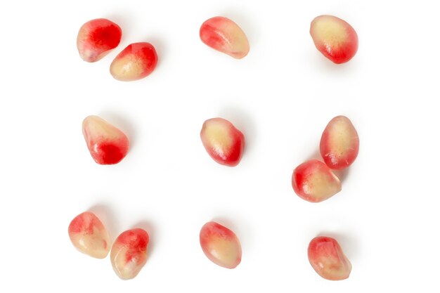 Fresh pomegranate seeds isolated on white background