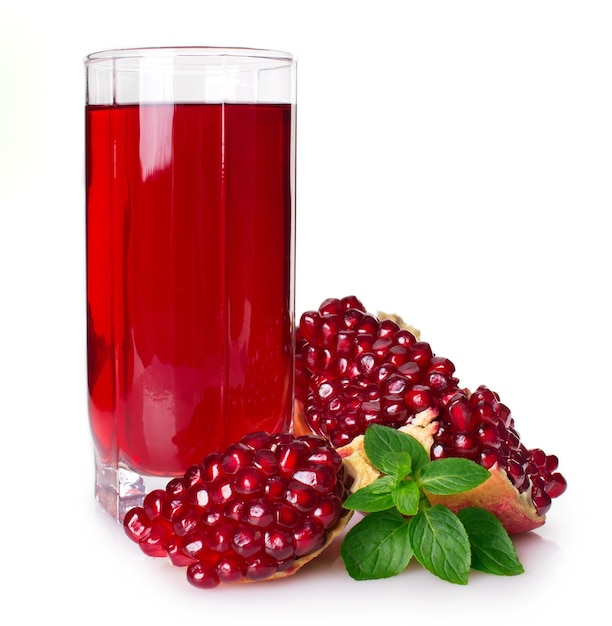 Fresh pomegranate with juice isolated on white background