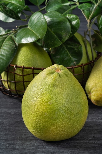 Fresh pomelo on black slate background for Mid-Autumn Festival fruit.