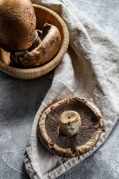 Fresh Portobello. Forest mushrooms. Gray background. Top view