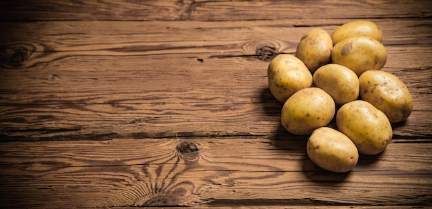 Fresh potatoes On a black background
