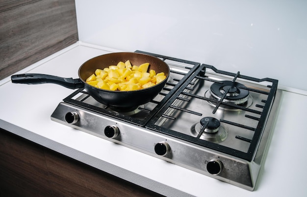 Fresh potatoes fried in a pan