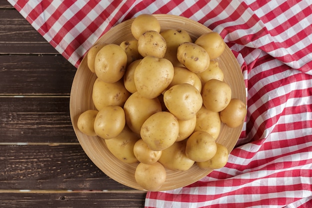 Fresh potatoes on the wood