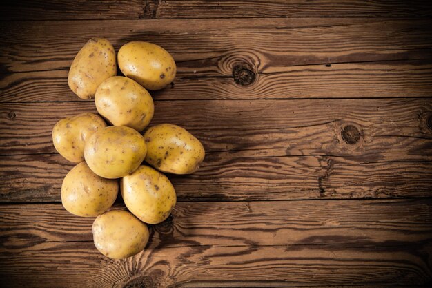Fresh potatoes On a wooden table