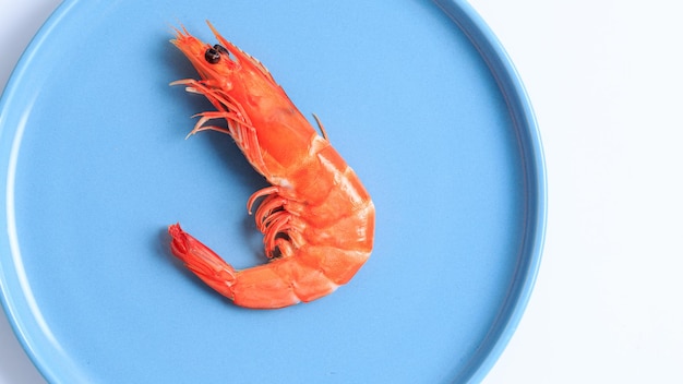 Fresh prawns cooked in a blue round plate