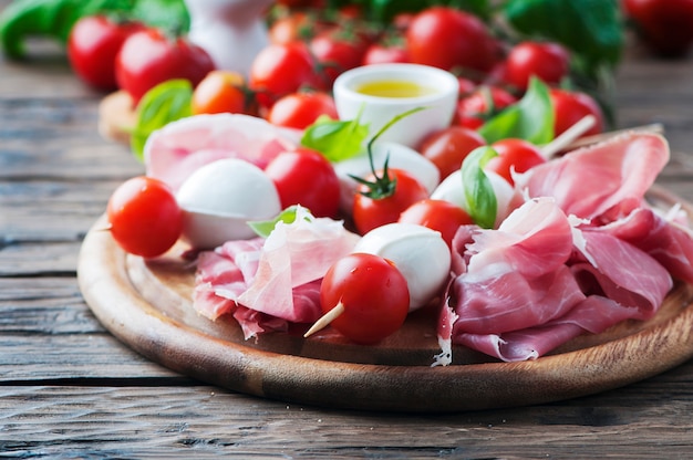 Fresh prosciutto with basil and mozzarella