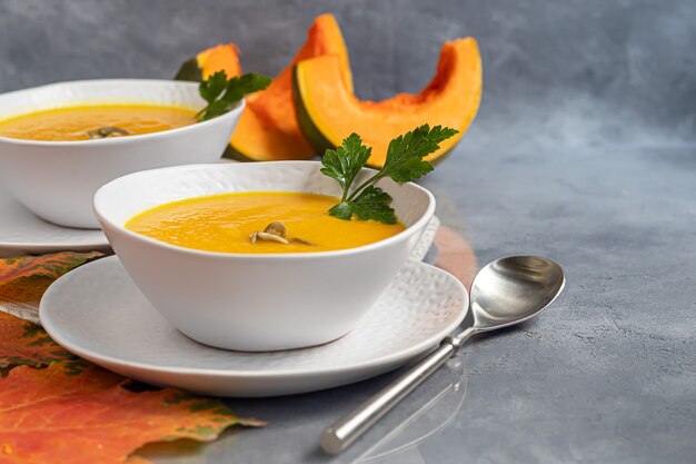 Fresh pumpkin cream soup in a white bowl