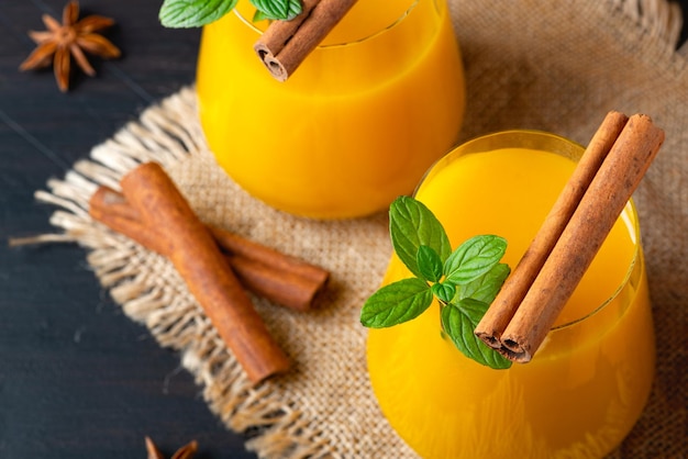 Fresh pumpkin juice in a glass cup Healthy and tasty food concept