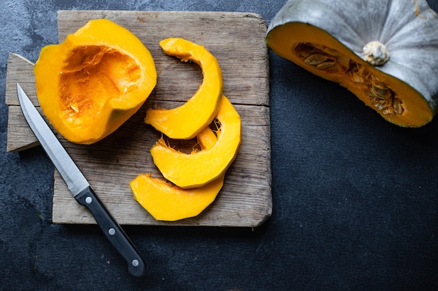 Fresh pumpkin on a wooden board