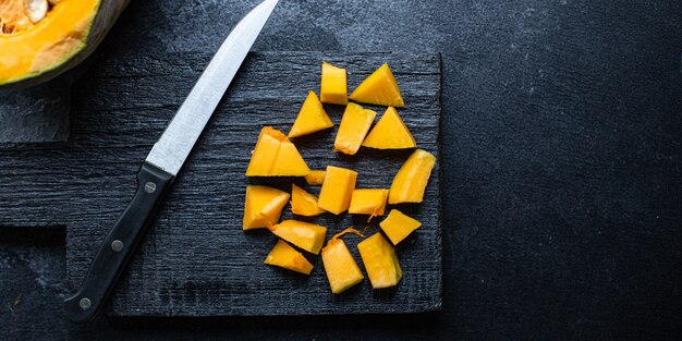 Fresh pumpkin on a wooden board