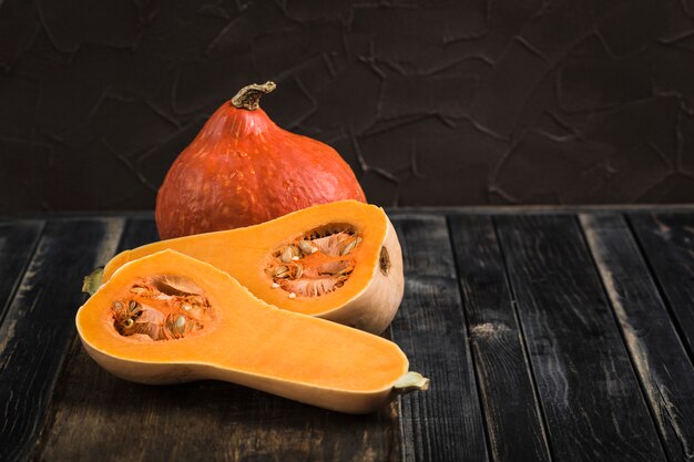 Fresh pumpkins on wooden surface