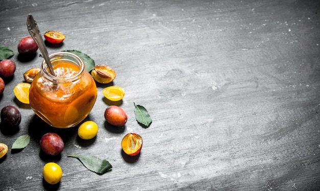 Fresh puree of ripe plums with green leaves