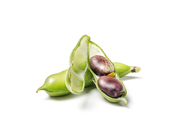 Fresh purple beans in a green pod isolated on white background String beans with clipping path