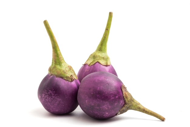 Fresh Purple eggplants on white background.