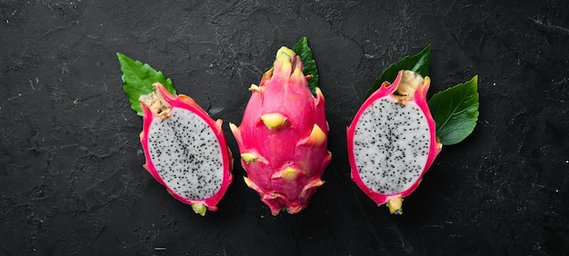 Fresh Pytahya on a black background Dragon Fruit Tropical Fruits Top view Free space for text