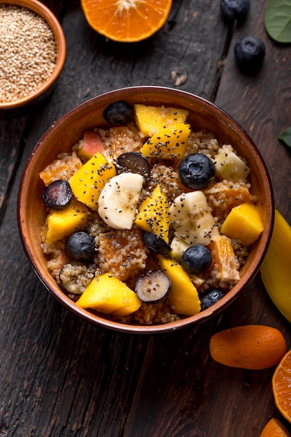 Fresh quinoa organic fruit salad in bowl 