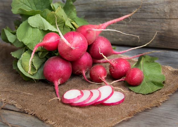 Fresh radish on a wooden table close up