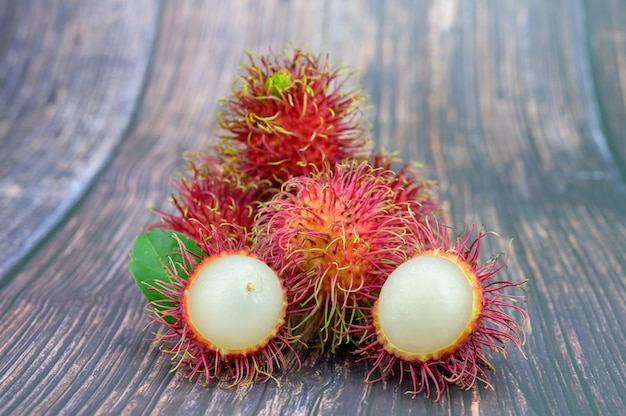 Fresh Rambutan on wooden table background