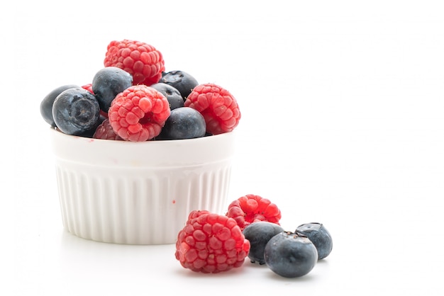 fresh raspberries and fresh blueberries on white