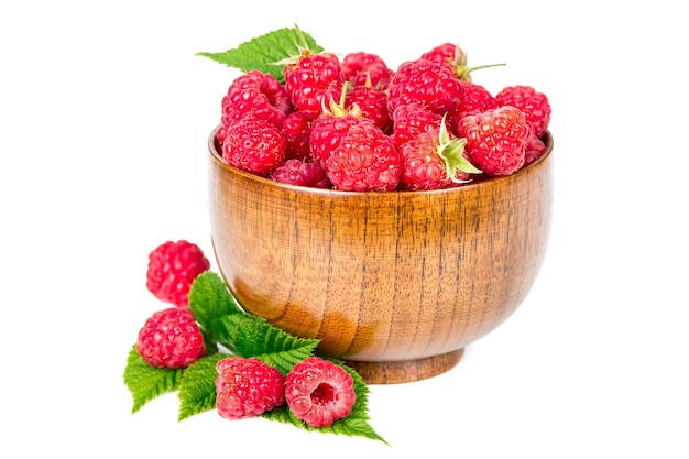 Fresh raspberries in wooden bowl isolated on white background