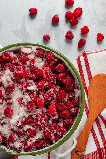 Fresh raspberry berry covered with granulated sugar jam preparation top view no people