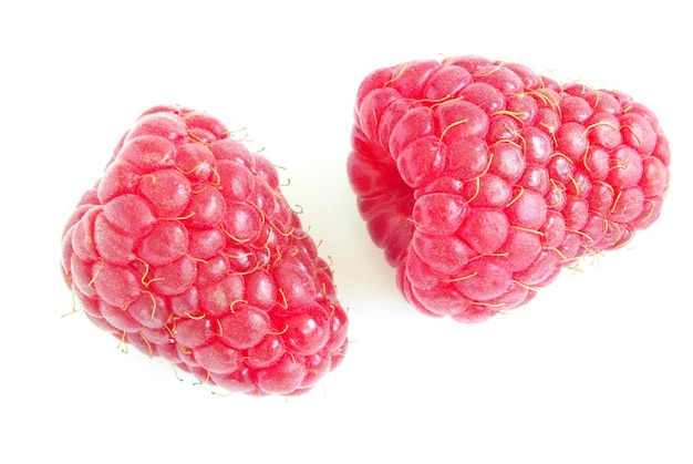 fresh raspberry fruits isolated on white background