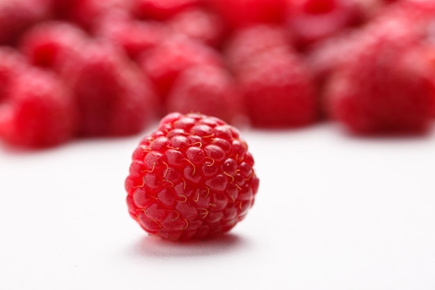 Fresh raspberry is on a white background