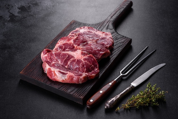 Fresh raw beef meat to make delicious juicy steak with spices and herbs.