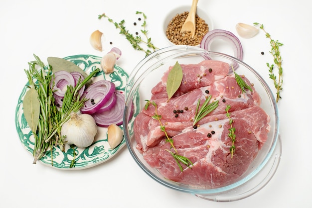 Fresh raw beef steak with spices isolated