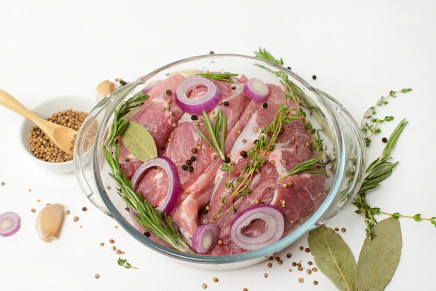 Fresh raw beef steak with spices isolated