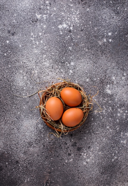 Fresh raw brown eggs in bowl. 