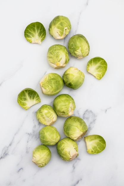 Fresh raw brussel sprouts on a marble background