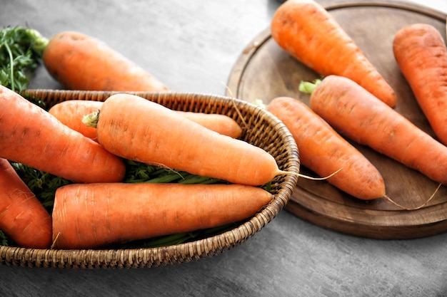 Fresh raw carrot on table