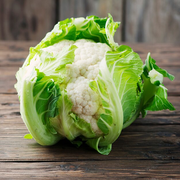 Fresh raw cauliflower on the wooden table