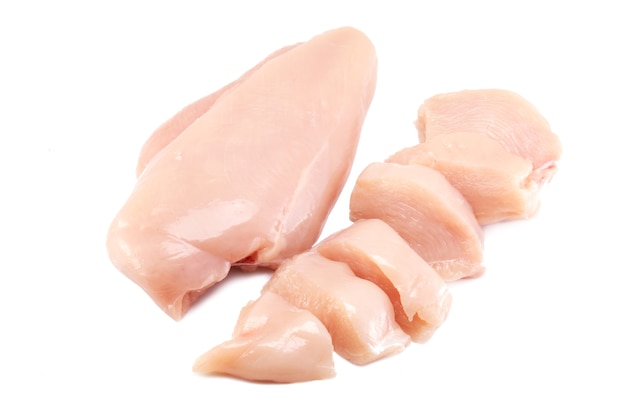 Photo fresh raw chicken breast fillet whole and sliced isolated closeup on white background, clipping path