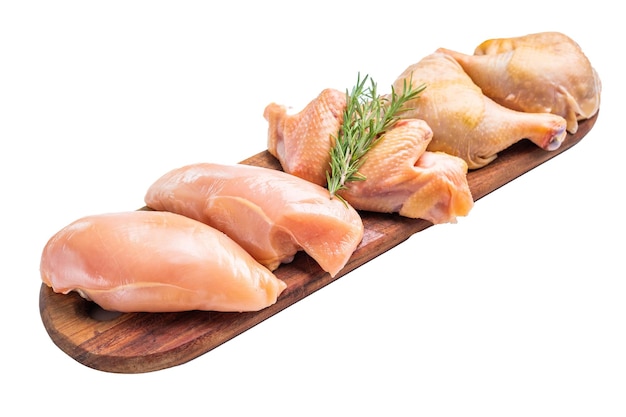 Fresh raw chicken breasts and legs on a wooden board isolated on white background