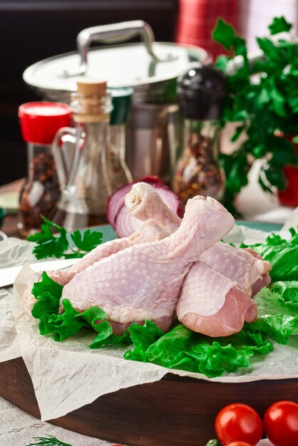 Fresh raw chicken drumsticks on the table