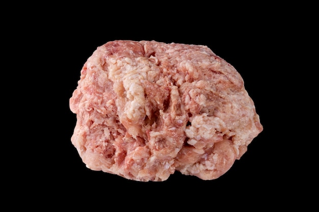 Fresh raw chicken mince isolated on black background