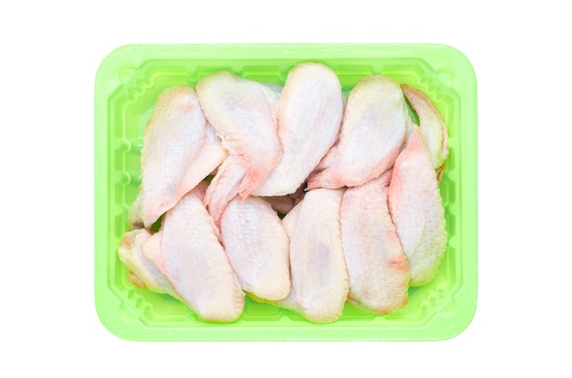 Fresh raw chicken wings in a green container