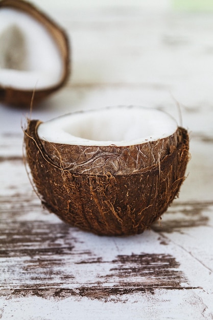 Photo fresh raw coconut on the wooden rustic table