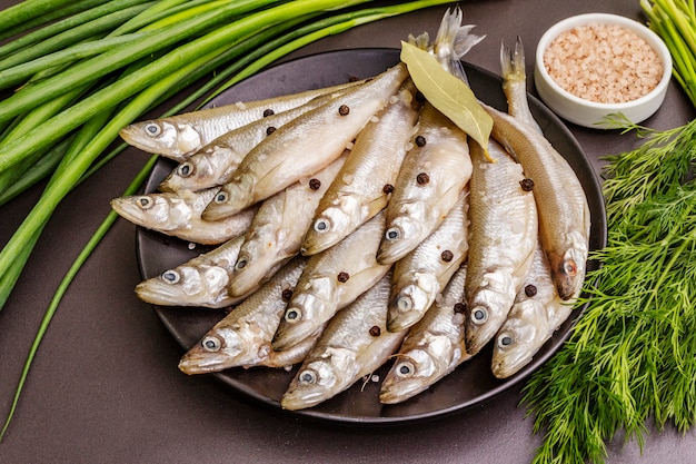 Fresh raw fish smelt or sardines ready for cooking