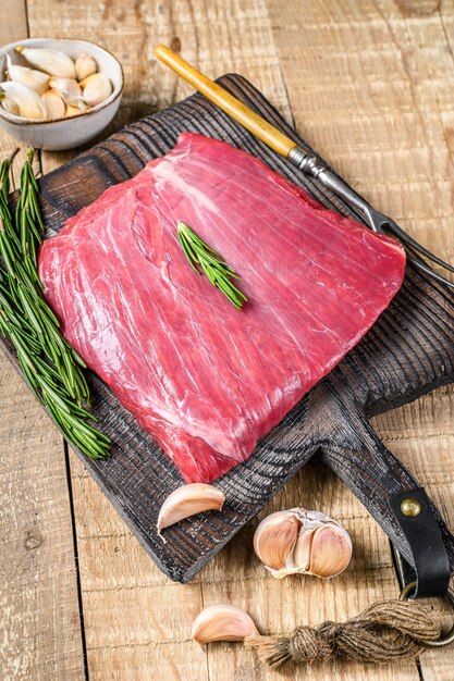 Fresh Raw flank or bavette beef marbled meat steak with rosemary