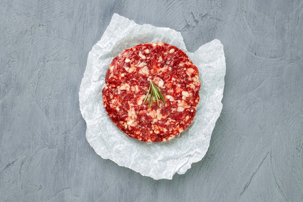 Fresh raw home made minced beef steak burger, close up