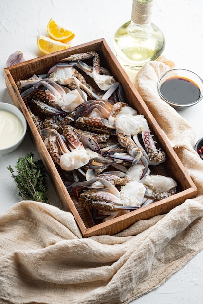 Fresh raw Horse crab, Blue crab, Flower crab set, in wooden box, on white table