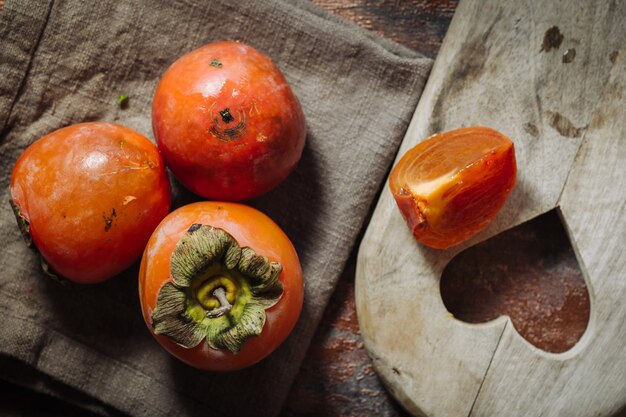 Fresh raw kaki fruits