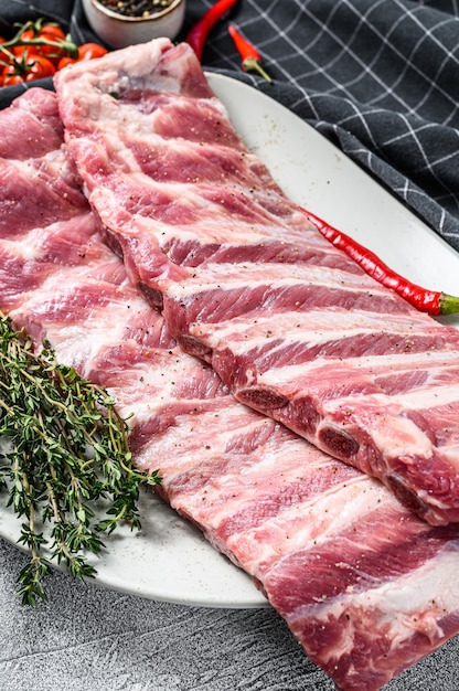 Fresh raw lamb spare ribs with spices and herbs